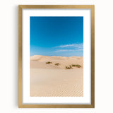 Elegant gold-framed landscape artwork featuring serene sand dunes, highlighted by a white mat, ideal for home decor. Perfect for enhancing any living space with a touch of nature.