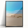 Framed acrylic artwork showcasing a stunning desert landscape with soft dunes in warm beige tones, presented in a sleek black frame, perfect for modern decor.