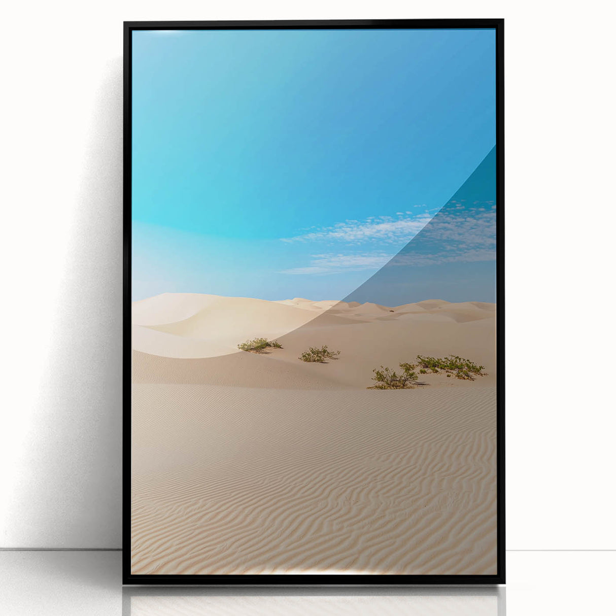 Framed acrylic artwork showcasing a stunning desert landscape with soft dunes in warm beige tones, presented in a sleek black frame, perfect for modern decor.