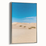 Framed canvas artwork depicting serene sand dunes in a landscape design, featuring a sleek silver frame and showcasing soft earth tones for a calming aesthetic. Ideal for modern home decor.