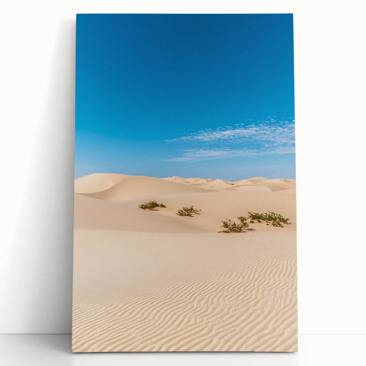 Stretched canvas artwork depicting serene sand dunes under a soft sunset sky, showcasing warm hues of orange and yellow, perfect for adding a tranquil touch to home decor.