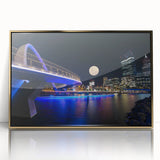 Mid-century modernist art depicting the Perth skyline in subdued gold tones on a framed acrylic print.