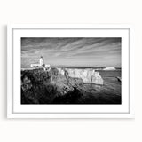Textured abstract art print of a Caribbean scenery in muted blue and green tones, framed with a white mat.
