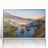 Mid-century modernist art depicting a European Croatian landscape in muted earth tones on a white framed acrylic.