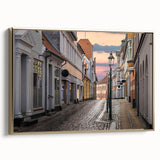 Framed canvas depicting a vintage European landscape in black and gold tones, suitable for bedroom wall art.