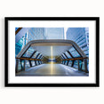 Colorful abstract art print of London scenery in vibrant hues on a large textured canvas, framed in black.