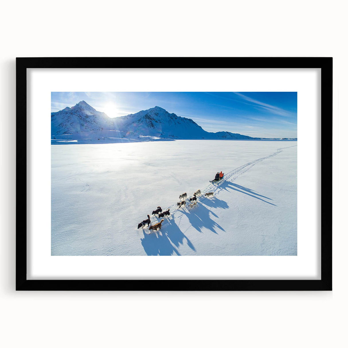 Extra large abstract art print featuring a textured, colorful Greenland scenery in a black frame with mat.