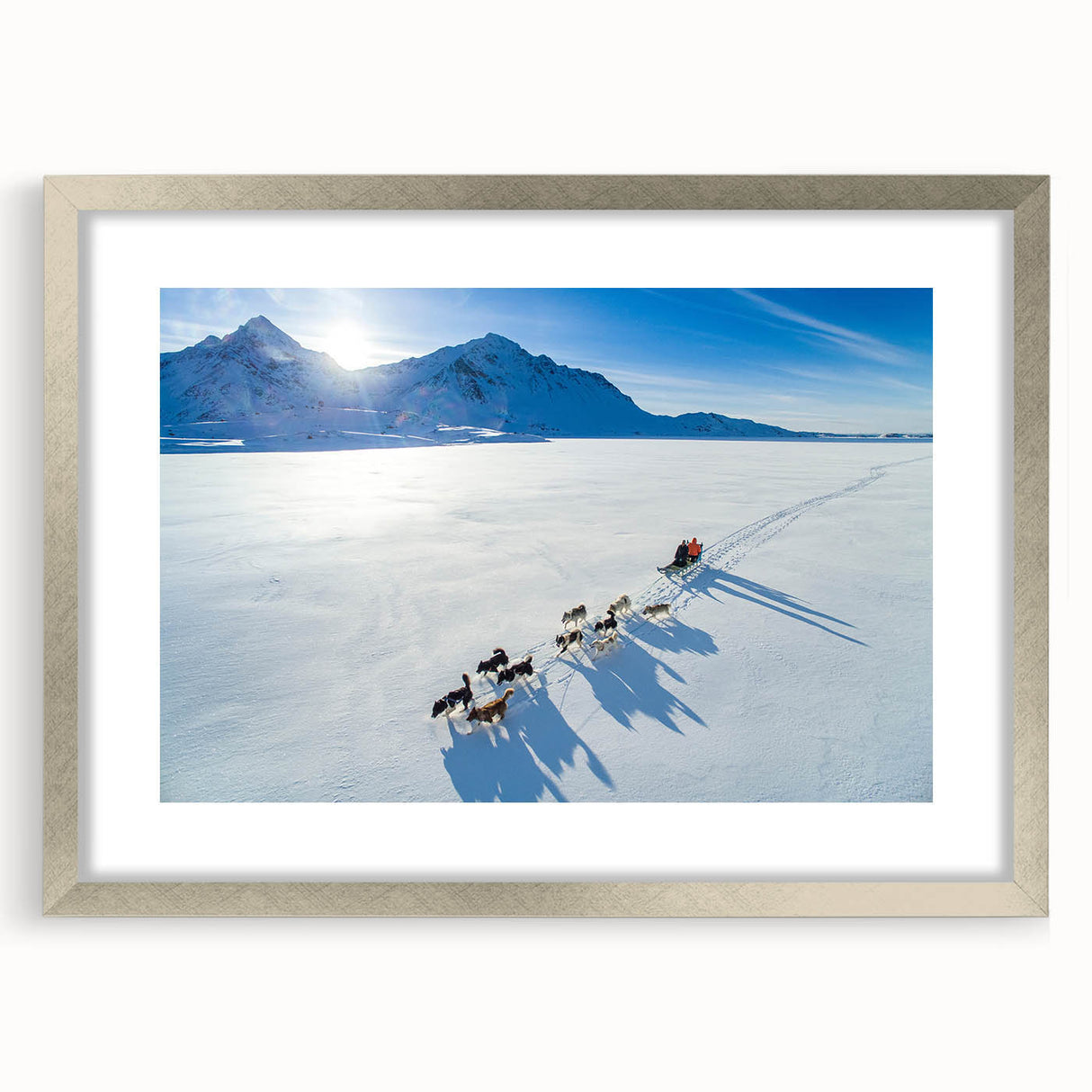 Extra large abstract art print of a Greenland landscape in muted green and blue tones on a silver-framed canvas.