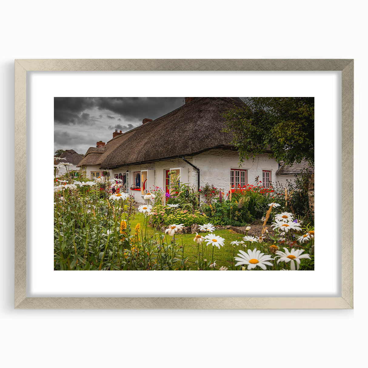 Textured abstract art print of a European landscape, using cool gray and green tones on a framed silver mat.