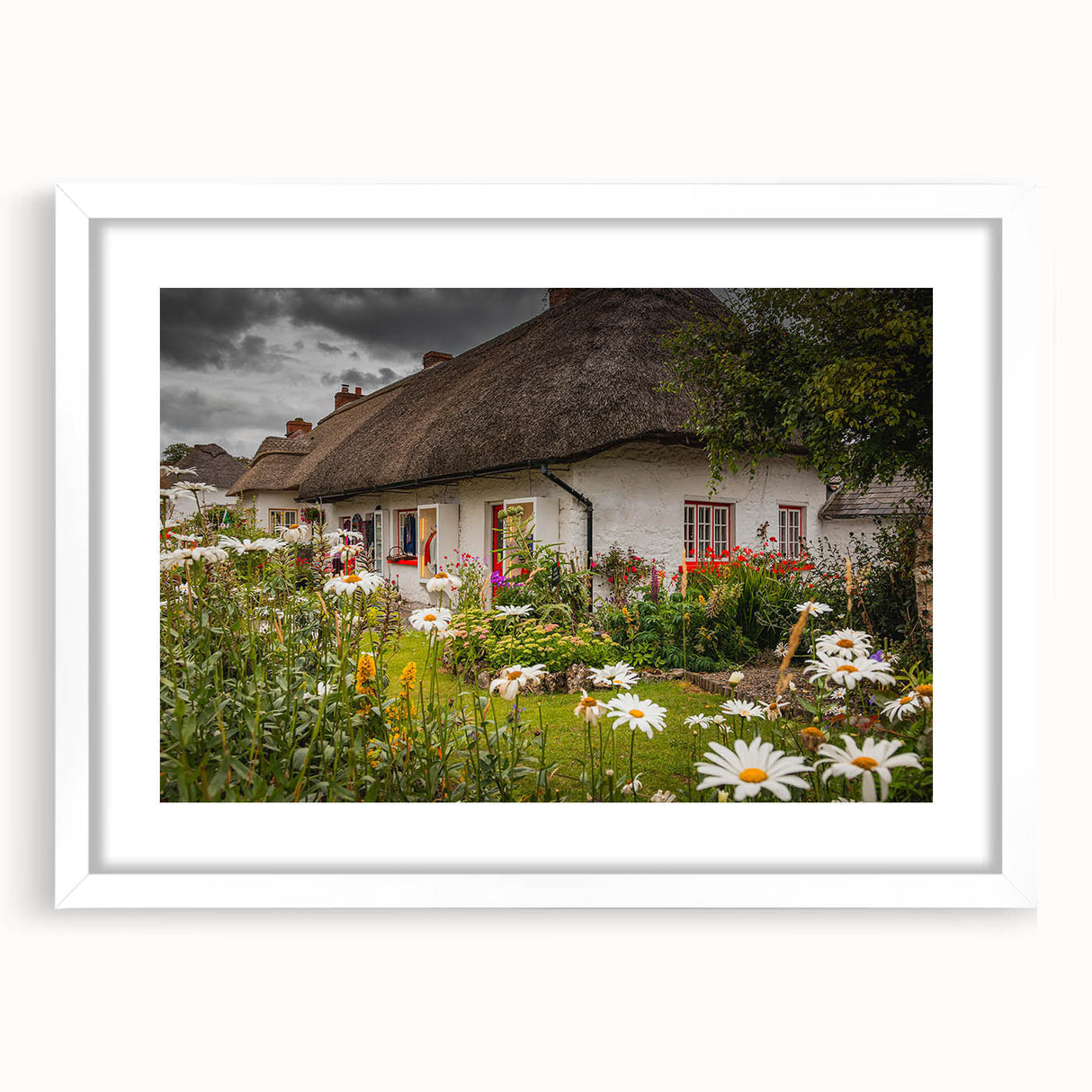 Abstract art print of a serene Irish landscape in muted green and blue hues, framed with a white mat.