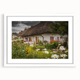 Abstract art print of a serene Irish landscape in muted green and blue hues, framed with a white mat.