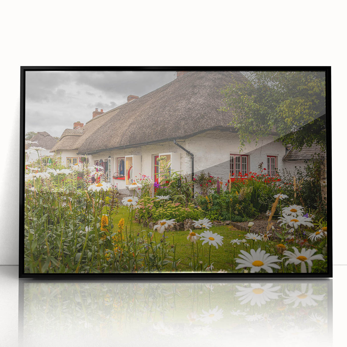 Large abstract wall art depicting a stylized Irish landscape in muted green and blue tones, framed in black acrylic.