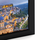 Close-up of textured black wall art depicting a colorful Sicilian landscape on a framed canvas, ideal for living room decor.