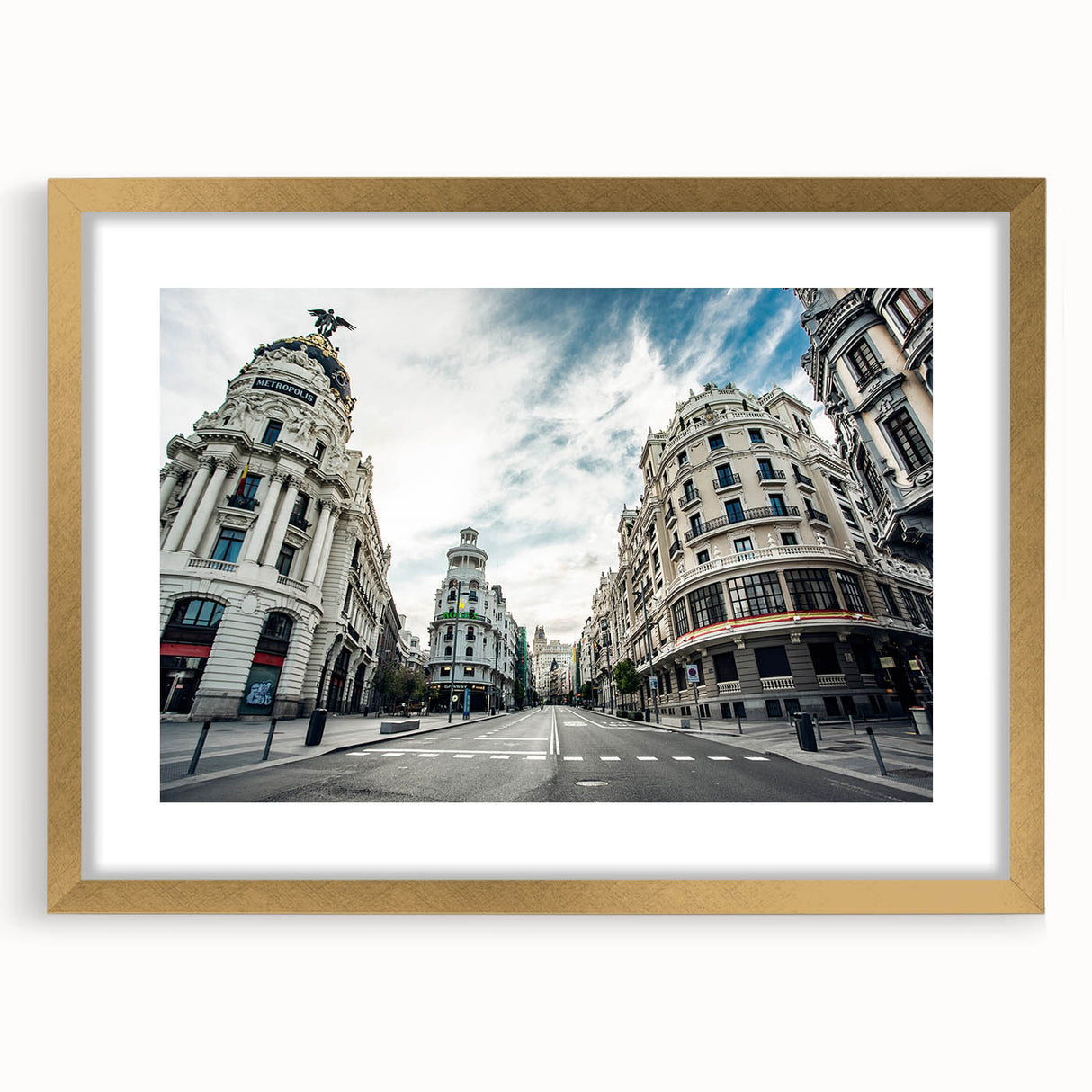 Extra large abstract art print depicting textured scenery of Madrid in muted earth tones, framed in gold.
