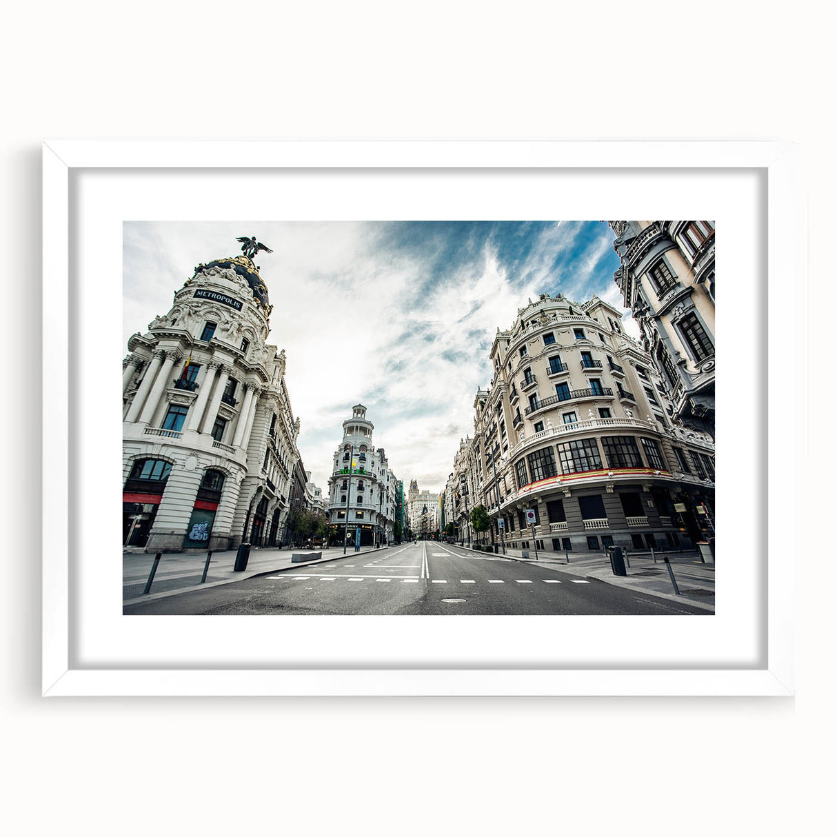 Abstract art print of Madrid skyline in muted blue and gray tones on a white framed canvas, suitable for dining room decor.