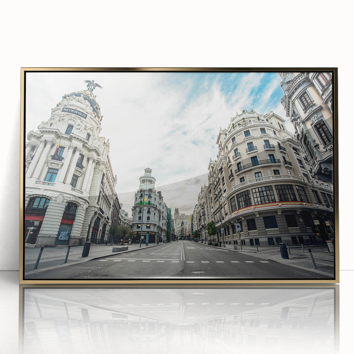 Large art print of Madrid with gold frame, featuring mid-century modernist style and a muted color palette.