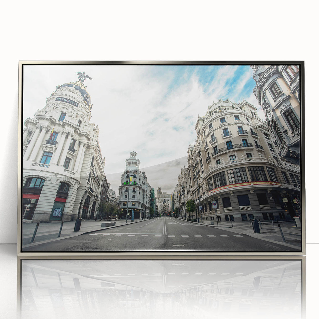 Mid-century modernist art depicting Madrid's skyline in muted gray and blue tones on a framed acrylic print.