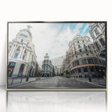 Mid-century modernist art depicting Madrid's skyline in muted gray and blue tones on a framed acrylic print.