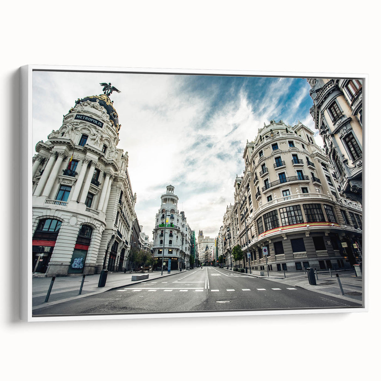 Vintage poster art of Madrid with vibrant colors on a large framed canvas, suitable for living room decor.
