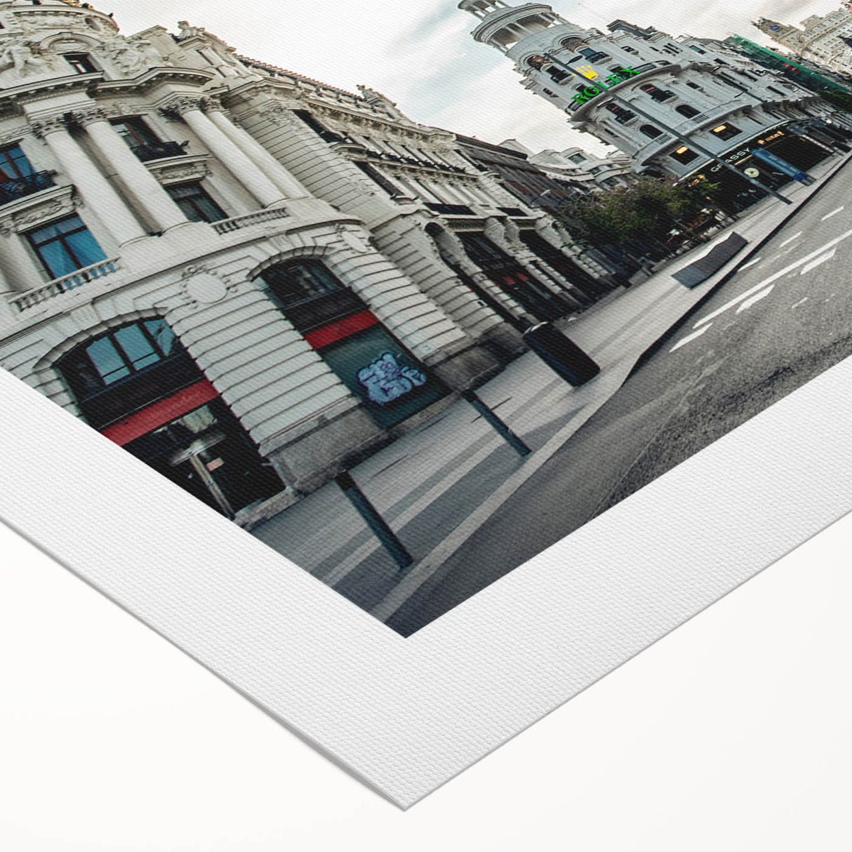 Art deco poster of Madrid skyline in muted earth tones on a rolled canvas, suitable for dining room decor.