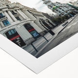 Art deco poster of Madrid skyline in muted earth tones on a rolled canvas, suitable for dining room decor.