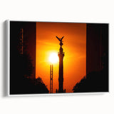 Vintage poster art of Mexico City on a framed canvas, featuring colorful buildings and black sky.