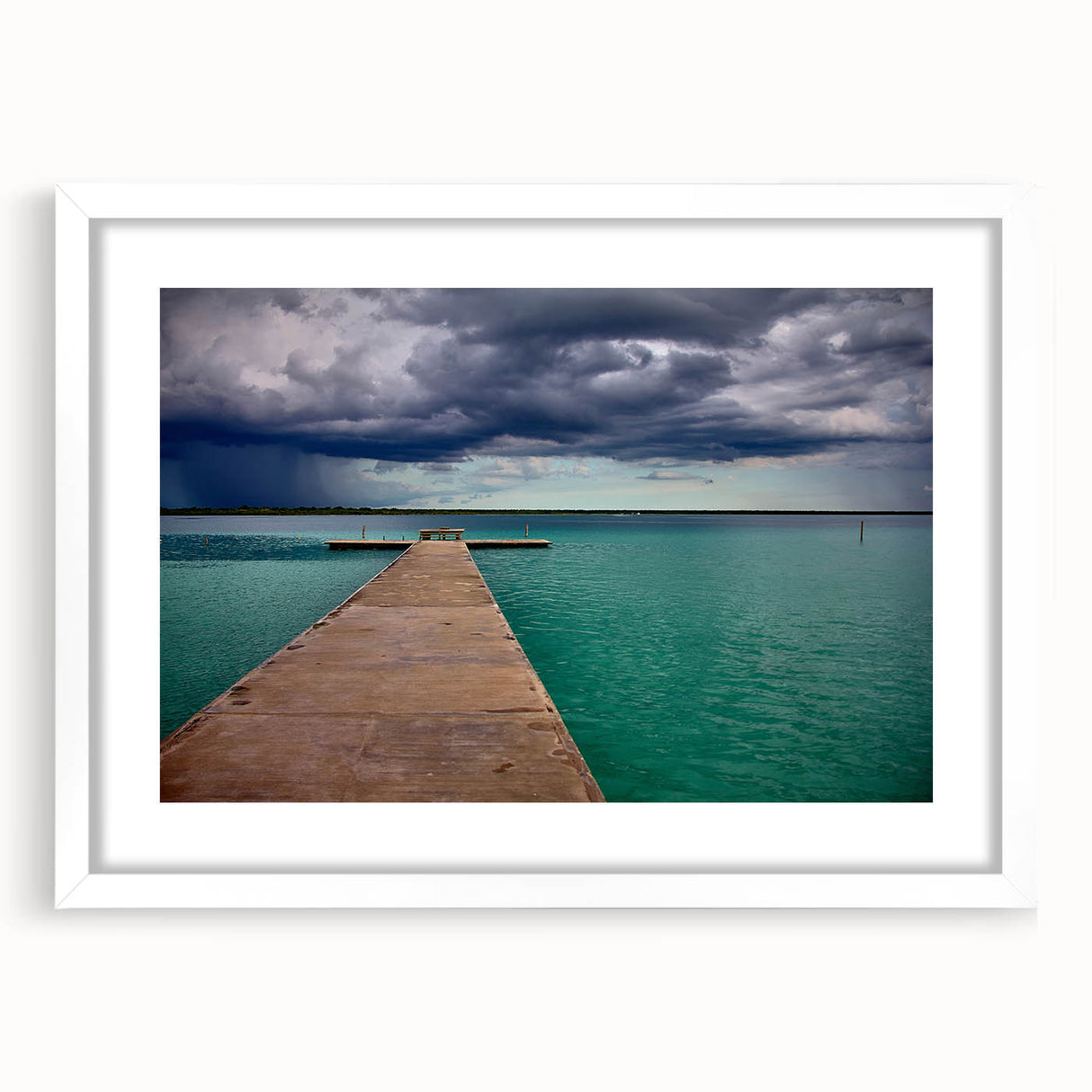 Abstract art print of Quintana Roo scenery in muted blue and green tones, framed with a white mat.