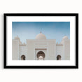 Abstract art print of a colorful, textured scenery, framed in black, ideal for living room decor.
