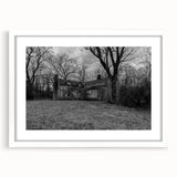 Abstract art print of Delaware scenery in muted blue and green tones on a framed white mat, suitable for dining room decor.