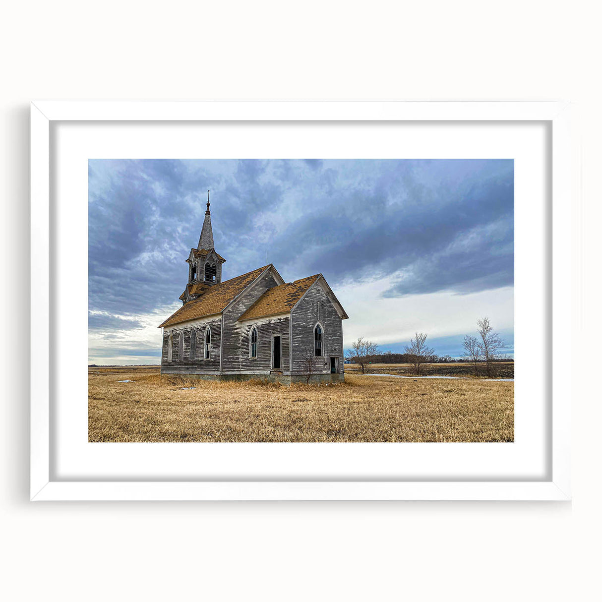 Abstract art print of Iowa scenery in muted earth tones on a white matted frame, suitable for dining room decor.