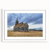 Abstract art print of Iowa scenery in muted earth tones on a white matted frame, suitable for dining room decor.