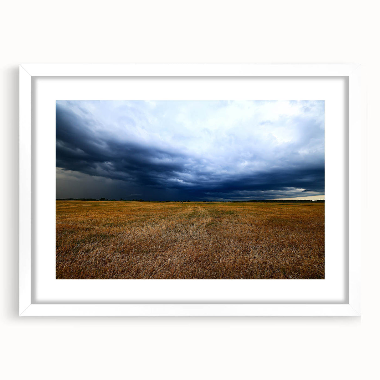 Abstract art print of Kansas scenery in muted earth tones on a white matted frame, ideal for dining room decor.