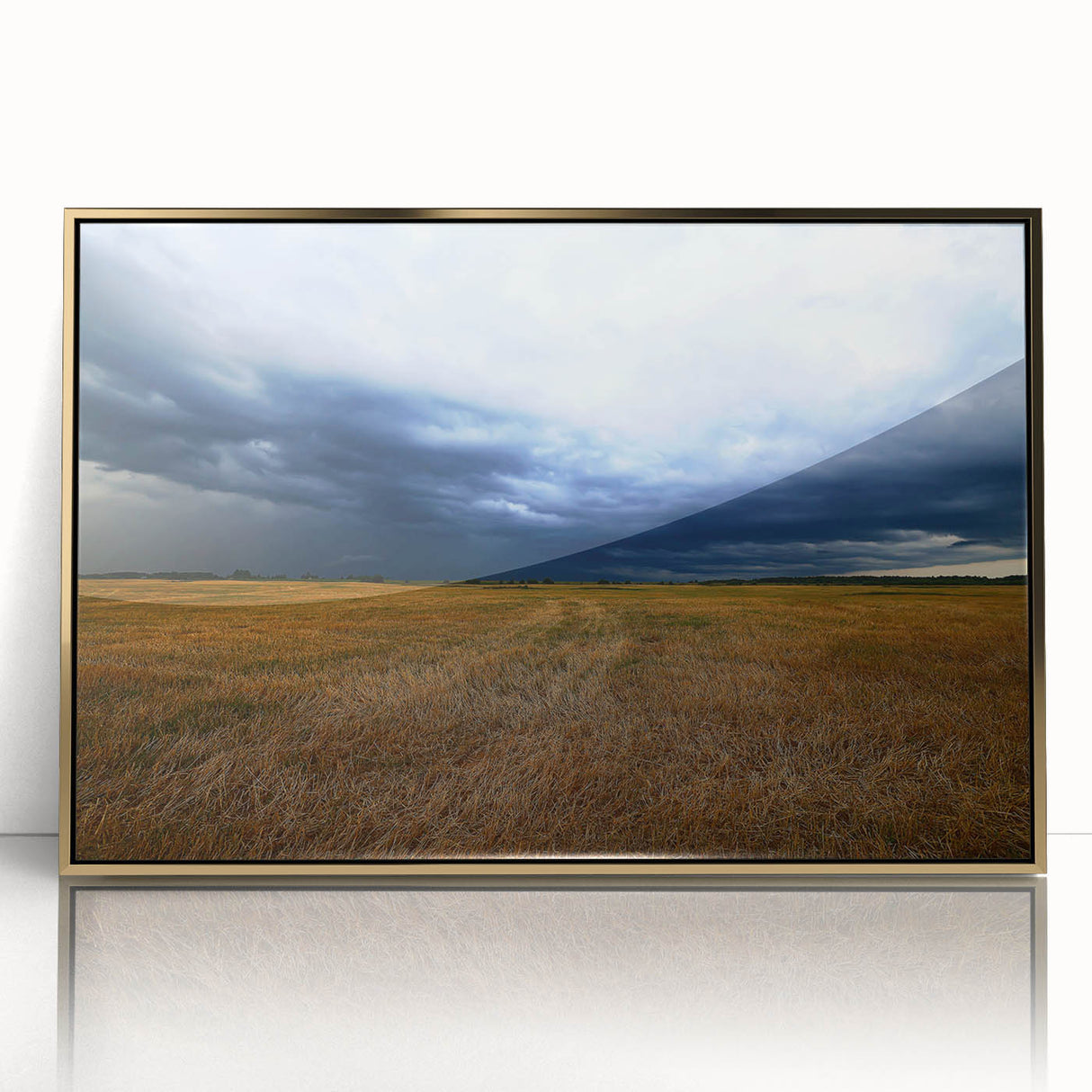 Large art print of a Kansas scenery in muted earth tones on acrylic, framed in gold, suitable for modern nursery wall decor.