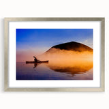Textured art print featuring an abstract depiction of Maine scenery in muted blue and gray tones on a framed silver mat.