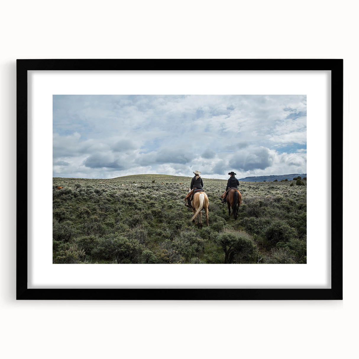 Colorful abstract art print of Montana scenery in vibrant hues on a large textured canvas, framed in black.