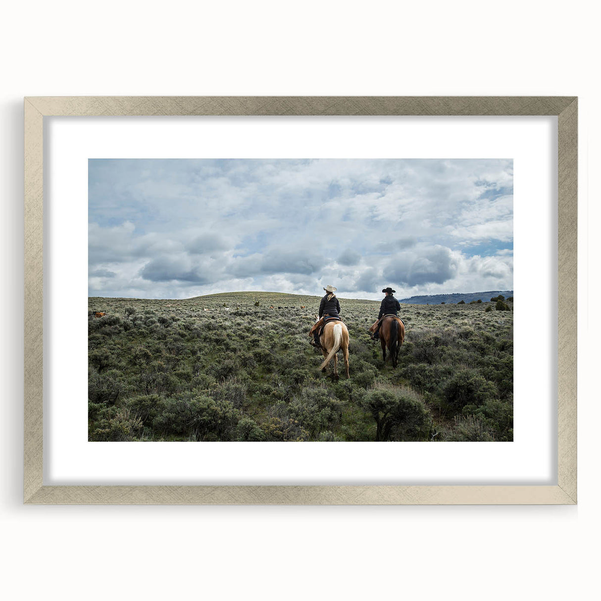 Textured abstract art print of a Montana landscape in muted earth tones, framed in silver, ideal for bedroom art.
