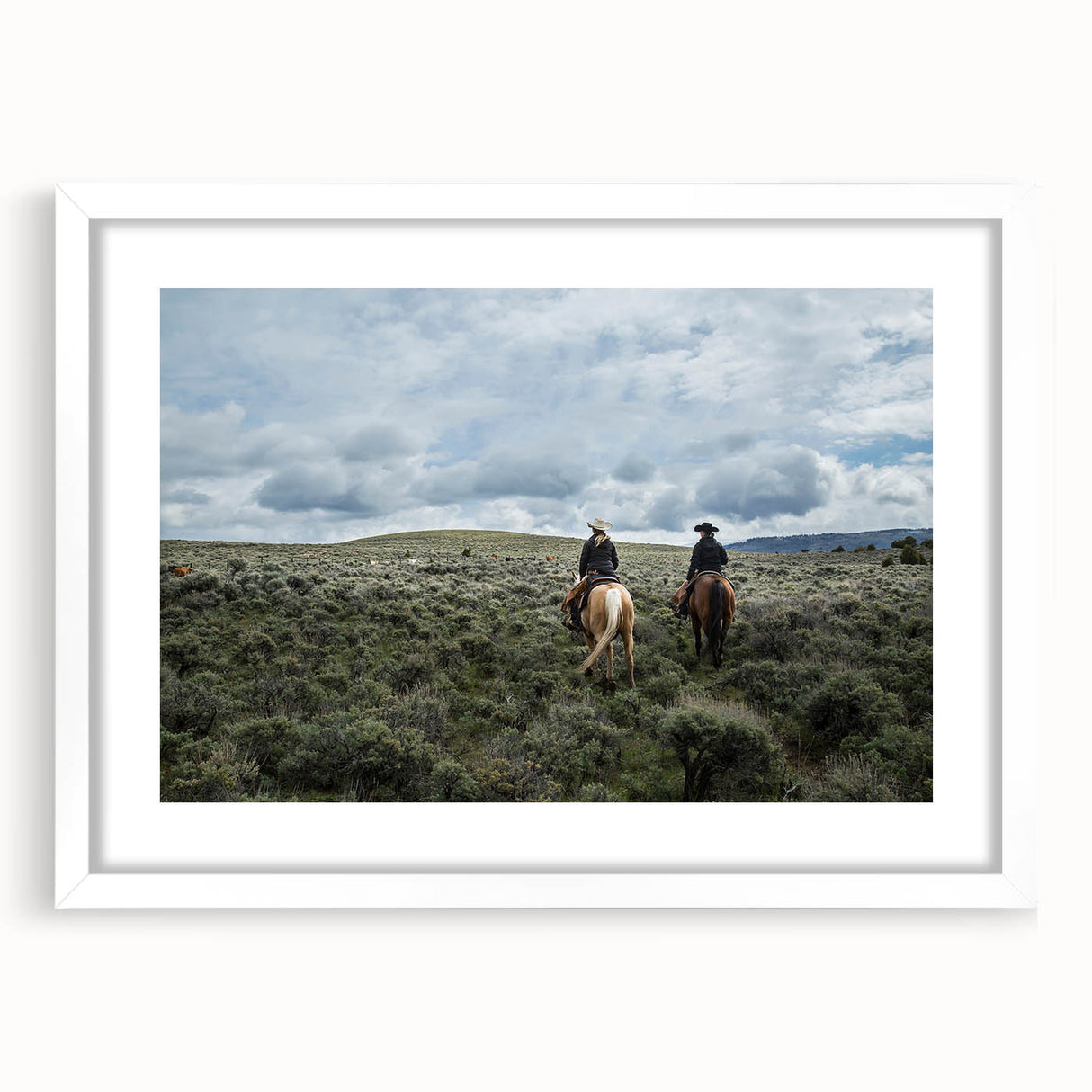 Abstract art print of Montana scenery in muted earth tones on a framed white mat, ideal for dining room decor.