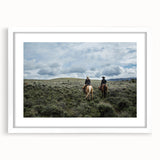 Abstract art print of Montana scenery in muted earth tones on a framed white mat, ideal for dining room decor.