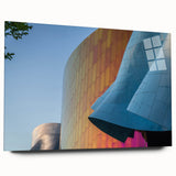 Large abstract wall art of Seattle skyline in muted blue and gray tones on acrylic glass.