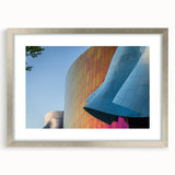 Textured art of abstract Seattle skyline in muted gray tones on a framed silver mat, ideal for bedroom wall decor.