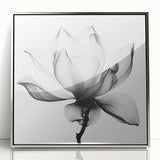 Framed acrylic artwork showcasing abstract floral designs in vibrant colors, set in a sleek silver frame, adding elegance to any modern decor.
