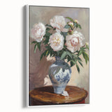 Framed canvas artwork displaying abstract floral designs in vibrant colors against a white background, showcasing elegance and modern decor style.