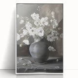 Framed acrylic artwork showcasing vibrant abstract floral designs in hues of pink, yellow, and blue, set against a sleek white background, perfect for modern home decor.