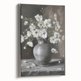 Framed canvas artwork showcasing vibrant abstract floral designs in rich colors, presented with a sleek silver frame, ideal for modern home decor.
