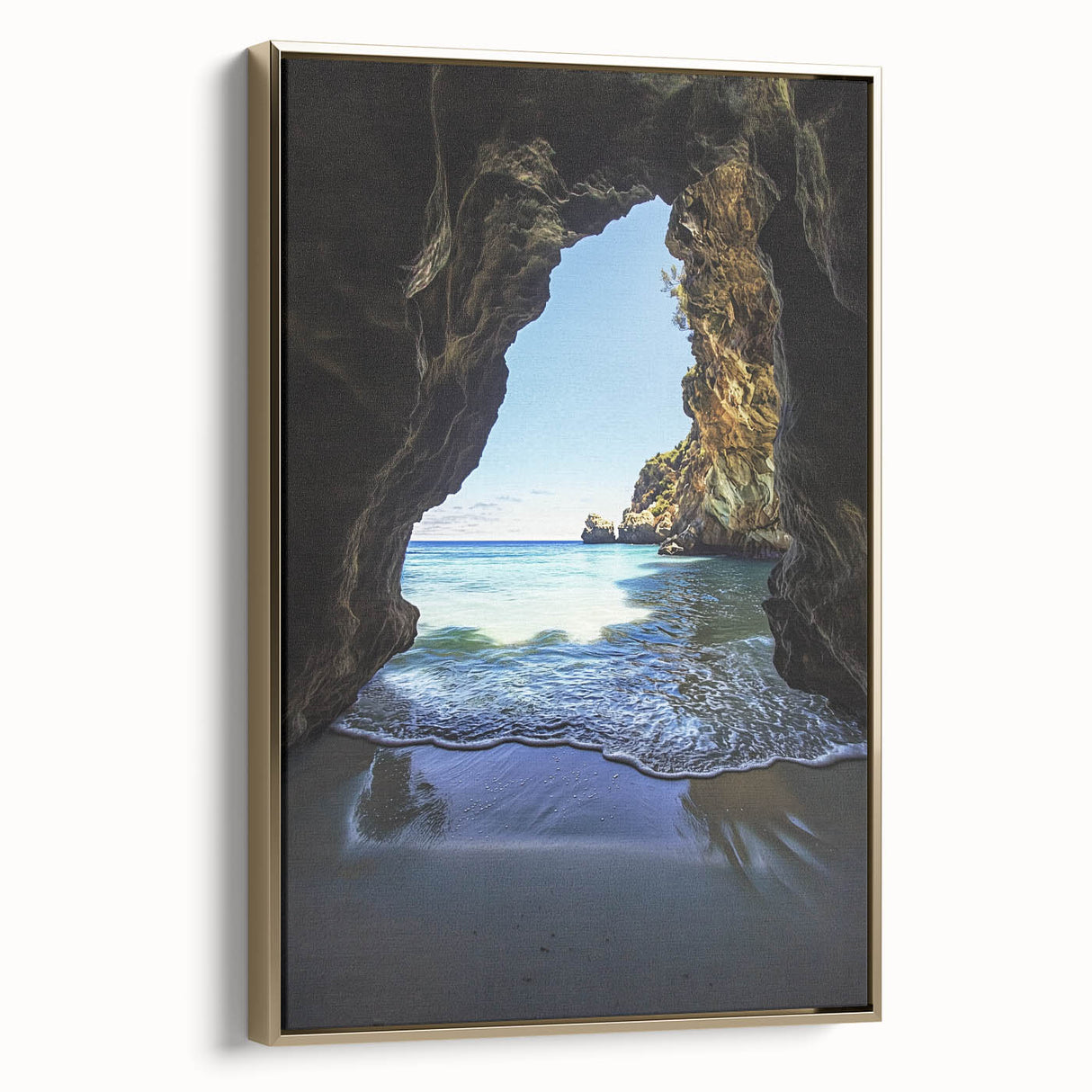 Framed canvas artwork showcasing a stunning landscape scene with caves, highlighted by a gold border, perfect for enhancing modern home décor.