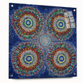 Abstract geometric acrylic glass art piece displayed from the side, showcasing vibrant colors and unique shapes, secured with decorative pins for stability.