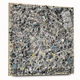 Abstract acrylic glass artwork displaying vibrant splatters in various colors, mounted with pins for stability. Ideal for modern decor, enhancing any space with a bold artistic touch.
