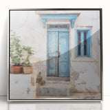 Mid-century modernist art featuring a silver-framed acrylic print of a Greek door, in muted earth tones.