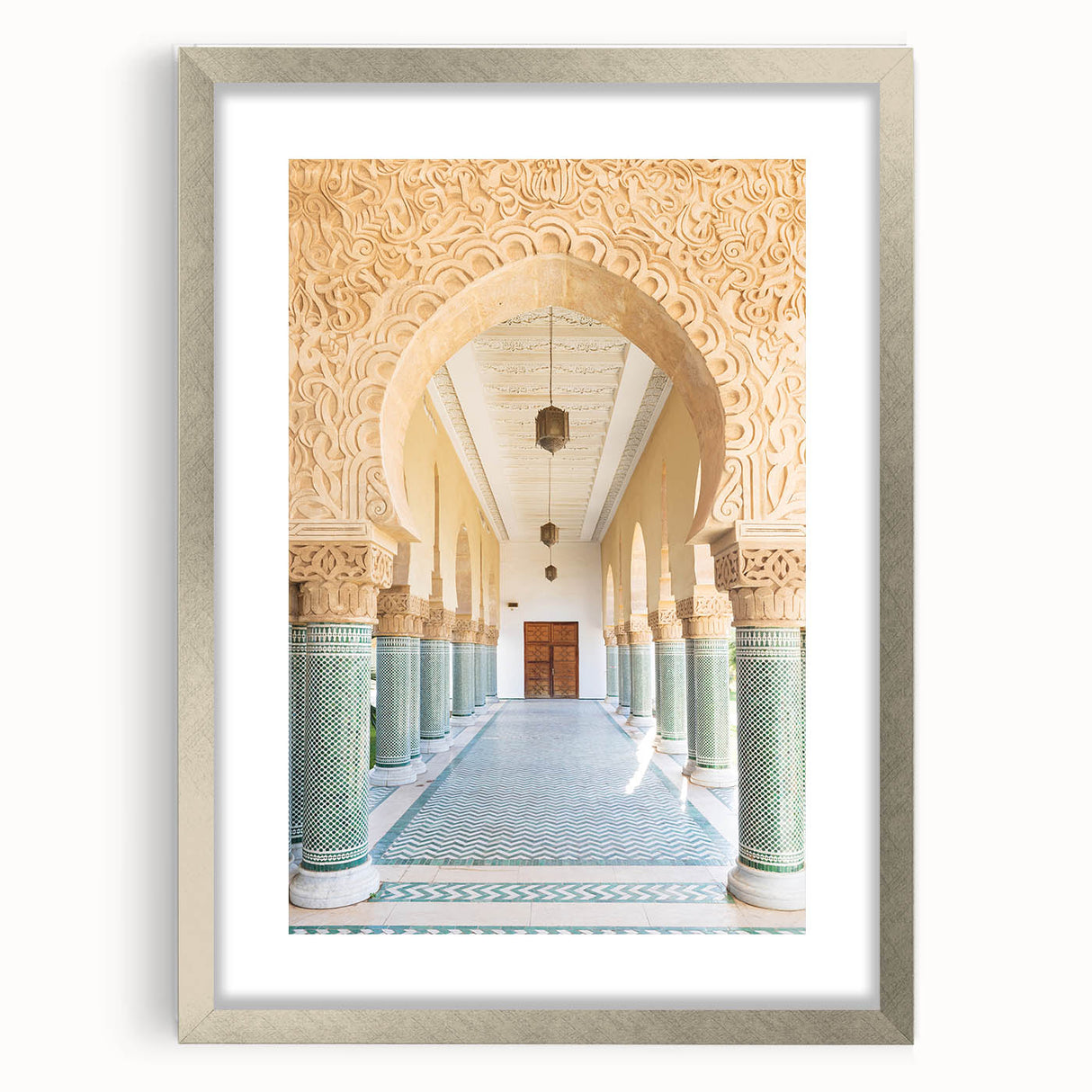 Abstract art print of a Moroccan landscape in earthy tones on a framed silver mat, suitable for dining room decor.