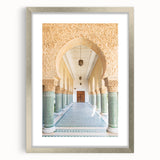 Abstract art print of a Moroccan landscape in earthy tones on a framed silver mat, suitable for dining room decor.